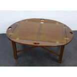 Mahogany Butlers tray style table with brass hinges and raised on square legs and cross stretcher,