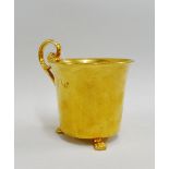 Early 19th century Meissen cabinet cup with solid gilt ground, raised on three paw feet, with kidney