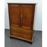 Mahogany press, the rectangular top with moulded edge over a pair of cupboard doors and two long