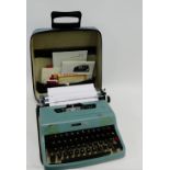 Vintage Olivetti Lettera 32 typewriter, complete with typewriter oil and case
