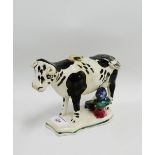 Staffordshire black and white cow creamer with a milkmaid to the green lined base, with an