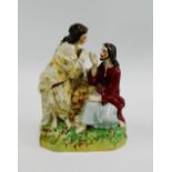 Staffordshire pottery group depicting "Christ and Mary Magdalene" on a rectangular sponged base,