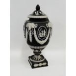 Wedgwood black and white Jasper urn vase and pierced cover with rams head mask heads, floral