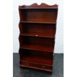 Waterfall front bookcase with two short drawers on bracket feet, 151 x 77cm