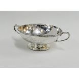 George V silver twin handled bowl with beaded rim and circular footrim, Birmingham 1928, 17cm wide