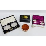 Mixed lot to include Epns jam spoons, butter dishes, small sauce ladle, lacquered Happy New Year box