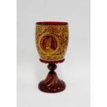 Venetian red glass goblet with gilt leaf and scroll pattern, an armorial crest and Mark Antonio