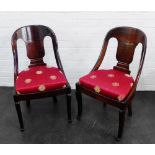 Pair of French Empire mahogany side chairs with curved backs and red upholstered seats on front