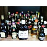 Quantity of whisky and liqueur miniatures, mostly sealed, with contents, (a lot)