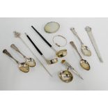 A mixed lot to include a London silver bookmark, Continental silver meat skewer, two toddy ladles,