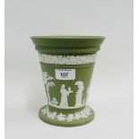 Wedgwood green and white Jasperware flared rim vase with fruit and vine borders and frieze of