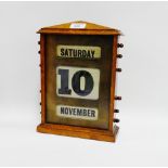 Early 20th century oak desk calendar, 22 x 32cm