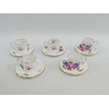 Set of five Aynsley floral patterned coffee cans and saucers, (5)