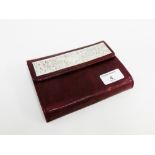 Italian silver mounted and leather wallet containing two packs of unopened playing cards, pencil and