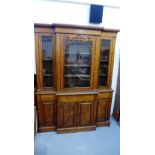 Victorian mahogany breakfront bookcase, the cornice top over three glazed doors with a shelved