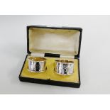 A cased set of two Birmingham silver napkin rings (2)