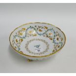 Le Tallec, Paris, French porcelain bowl with gilded fruit and vine pattern raised on three out swept