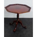 Mahogany pedestal table with octagonal top and claw and ball feet, 69 x 73cm