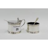 George V silver salt and mustard pots of circular form with blue glass liners and one original