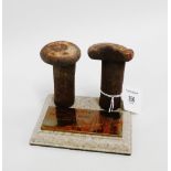 Two original rivet from the Forth Rail Bridge on a plinth base with presentation plaque, 12 x 11cm