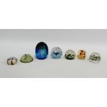 Collection of seven paperweights to include a Caithness "Splash Down" and Selkirk glass etc., (7)