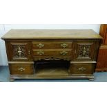 Large oak sideboard, the rectangular top with moulded edge over two long drawers and a pair of