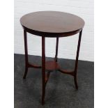 Mahogany oval topped two tier table, 77 x 60cm