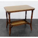 Early 20th century oak two tier side table, the rectangular top with canted corners and raised on