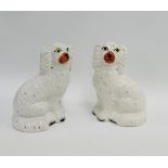 Pair of white glazed Staffordshire chimney spaniels, 22cm high, (2)