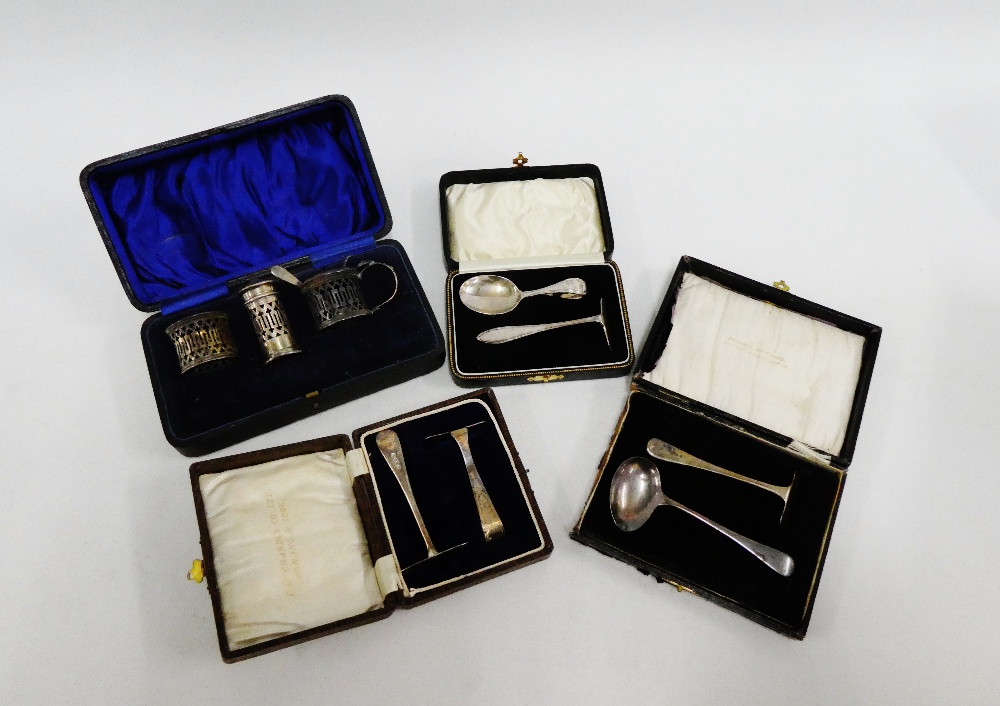 Three early 20th century silver pusher sets together with a cased set of cruets (liners lacking) (4)