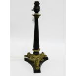 Ebonised wooden table lamp base with brass collar and hairy paw feet, 40cm high