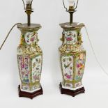 Pair of Canton Famille Rose hexagonal table lamps painted with figures, birds, flowers, foliage