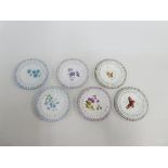 Set of six continental porcelain flower and butterfly patterned plates with pierced rims, 15cm