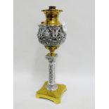 The Miller Lamp USA, a brass and white metal oil lamp, 52cm high overall