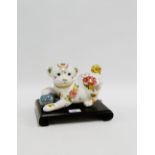 Imperial Puppy of Satsuma on a shaped hardwood stand, 22cm long