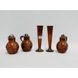 Two copper and brass vases, together with three copper Jersey milk jugs inscribed "WSC Penney