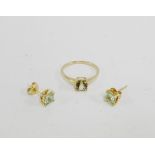 9 carat gold topaz claw set dress ring and pair of matching stud earrings (2)