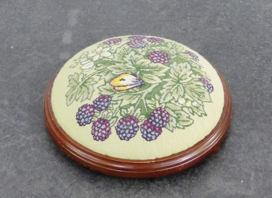 Circular footstool with tapestry top