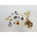 Costume jewellery to include chains, faux pearls, paste set brooches and a ARP cap badge, etc (a