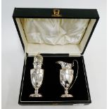 George V silver sugar castor and cream jug set by Wilson & Sharp, Birmingham 1935, in a fitted