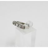 18 carat white gold five stone diamond ring, claw set with circular bright cut diamonds, with London