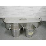 Two Moet & Chandon stainless steel champagne buckets and a fish kettle, (3)