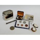 A mixed lot to include a St Cuthbert's bank, Decimal coins, propelling pencil and costume