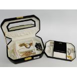 Black leather jewellery box containing a collection of costume jewellery and faux pearls, etc (a