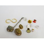 Mixed lot to include an unmarked gold mounted lava cameo and two white metal framed buttons, gold