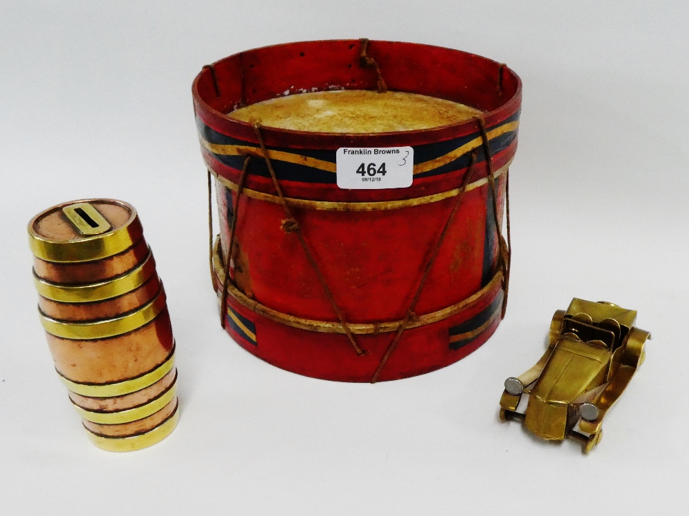 Painted drum, together with a brass and copper barrel money bank and a miniature brass car, (3)