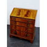 Mahogany bureau, the fall front opening to reveal a fitted interior, over four long drawers, on