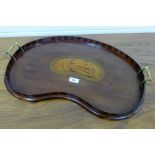 Mahogany and inlaid kidney shaped tray with shell patarae to centre and brass handles to side, 60