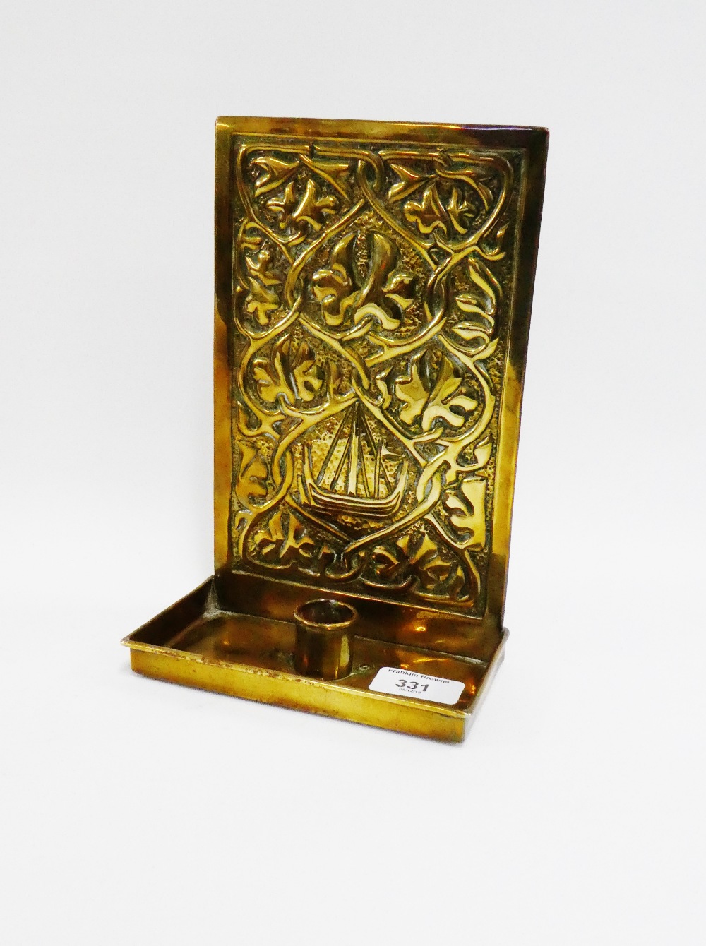 Alexander Ritchie, Iona brass wall candle sconce, the backplate embossed with Viking Ship motif