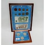 A frame containing British Pre-Decimal currency and three Royal Crowns